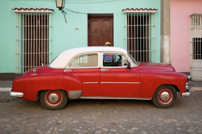 Jeffrey Milstein<br /> <em>Car and Superman, Trinidad, Cuba, </em>2004<br /> Archival pigment prints<br /> 16 x 24" &nbsp; &nbsp;Edition of 15<br /> 22 x 33" &nbsp; &nbsp;Edition of 5
