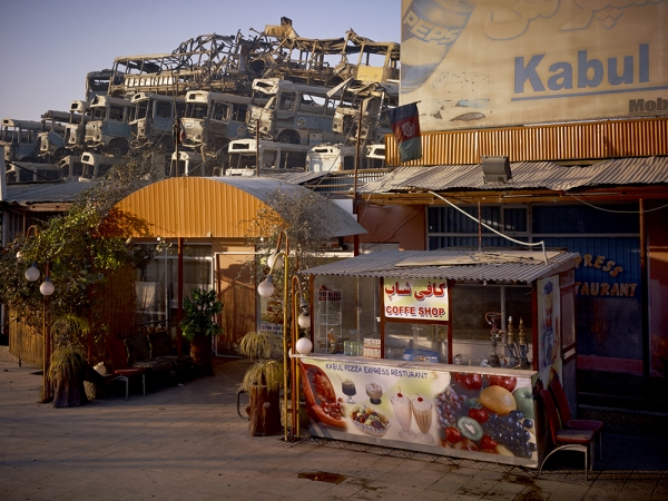 Simon Norfolk<br /> <em>Kabul 'Pizza Express' Restaurant Behind The Municipal Bus Depot, </em>2010<br /> Archival pigment ink prints<br /> 20 x 24" &nbsp; &nbsp;Edition of 7 (plus 2 APs)<br /> 40 x 50" &nbsp; &nbsp;Edition of 7 (plus 2 APs)