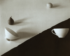 Jed Devine, Pear, Lemon, and Two Cups on Black and White Paper