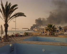 Simon Norfolk<br /> <em>Storage Depot for Powerstation Jiyeh, From Sand's Rock Resort, Lebanon, </em>2006<br /> Digital chromogenic prints<br /> 20 x 24" &nbsp; Edition of 10 (plus 3 APs)<br /> 40 x 50" &nbsp; Edition of 10 (plus 3 APs)